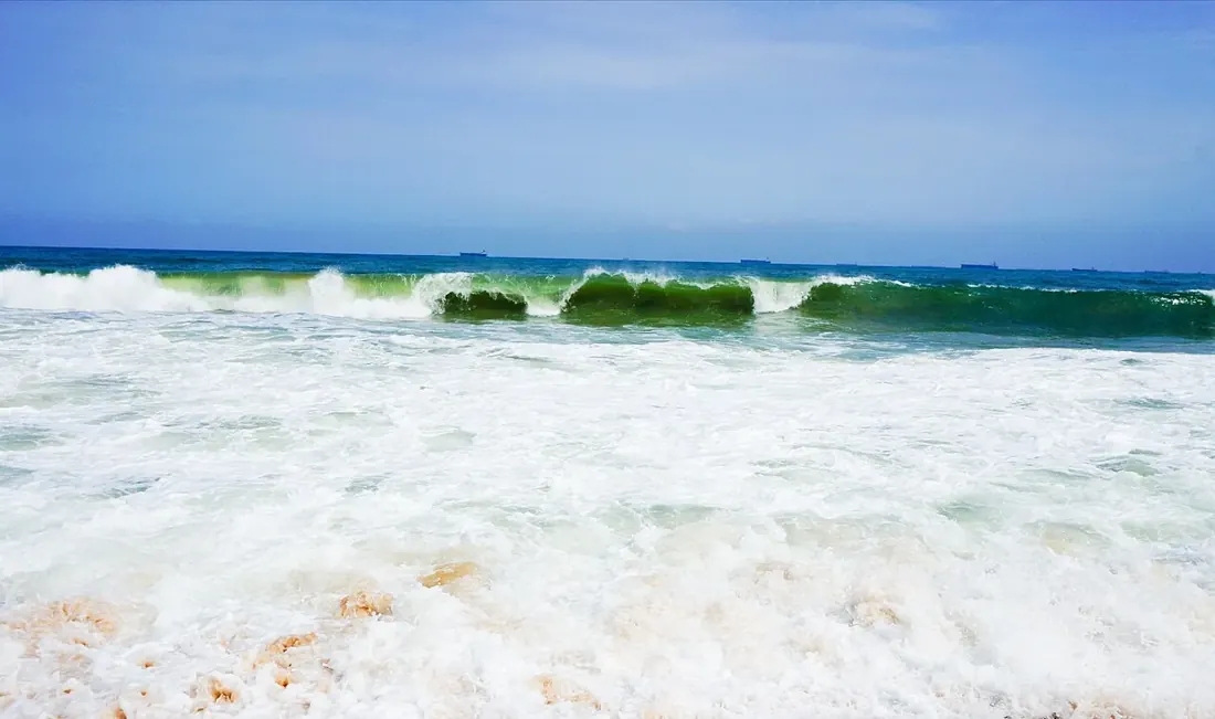 Atlantic Ocean waves breaking on the sandy shore of Lekki Beach in Lagos.