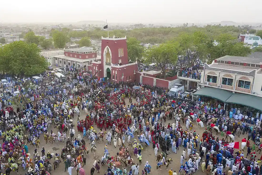 Crowds watching a Durbar procession outside the Emir’s Palace in Kano.
