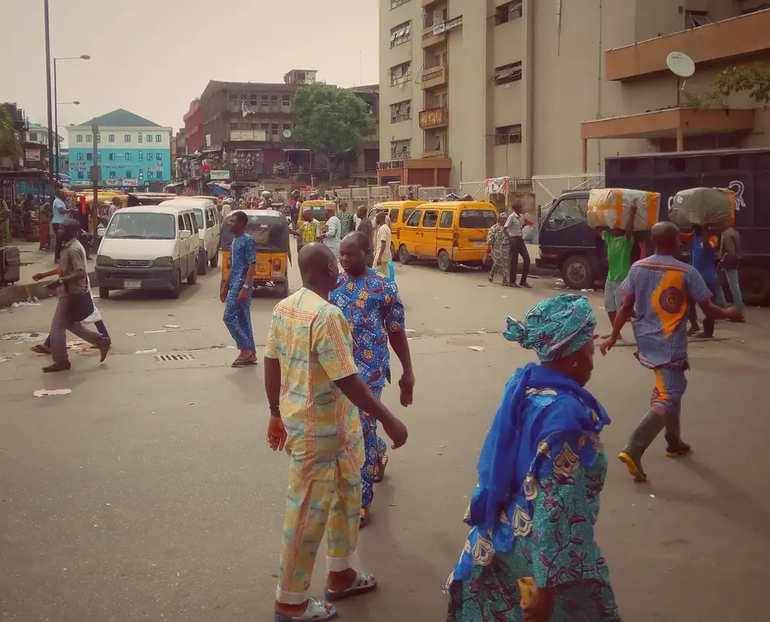 People walking through Tejuoso Market in Lagos.